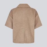 Short-sleeved cape jacket in beige/brown in a soft wool blend. The Siljamd cape has a collar, pockets, and nice brown buttons. Perfect layering over a knit for an elegant, seasonal look.