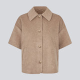 Short-sleeved cape jacket in beige/brown in a soft wool blend. The Siljamd cape has a collar, pockets, and nice brown buttons. Perfect layering over a knit for an elegant, seasonal look.