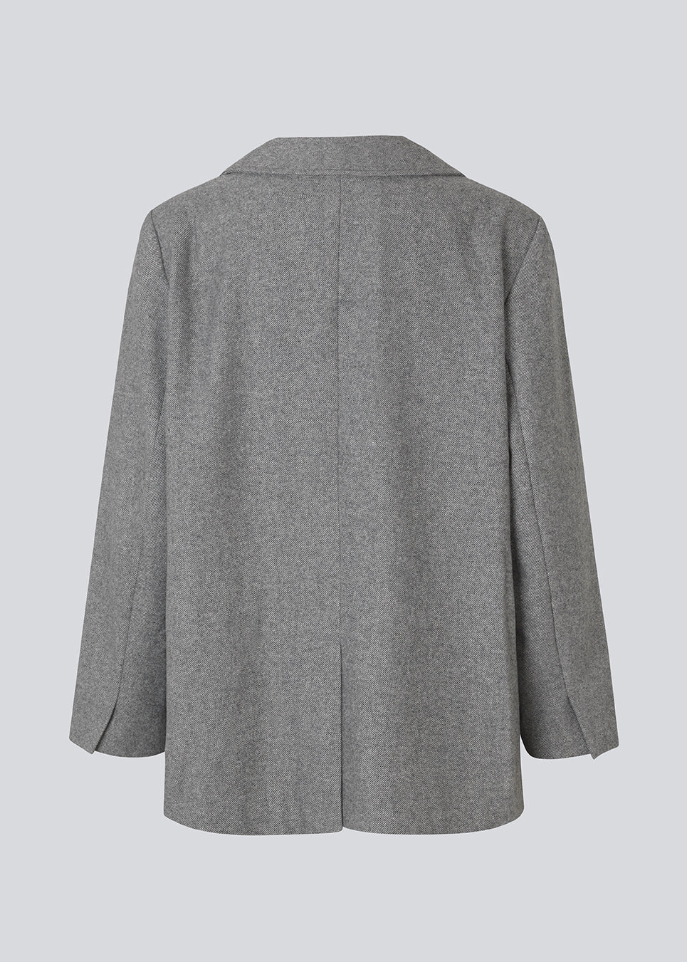 Grey blazer in wool blend. The Simonmd blazer has a collar, long sleeves and two spacious pockets. It closes with a simple, visible button and is perfect as a transitional jacket or as a warm layer over a t-shirt during the winter months.