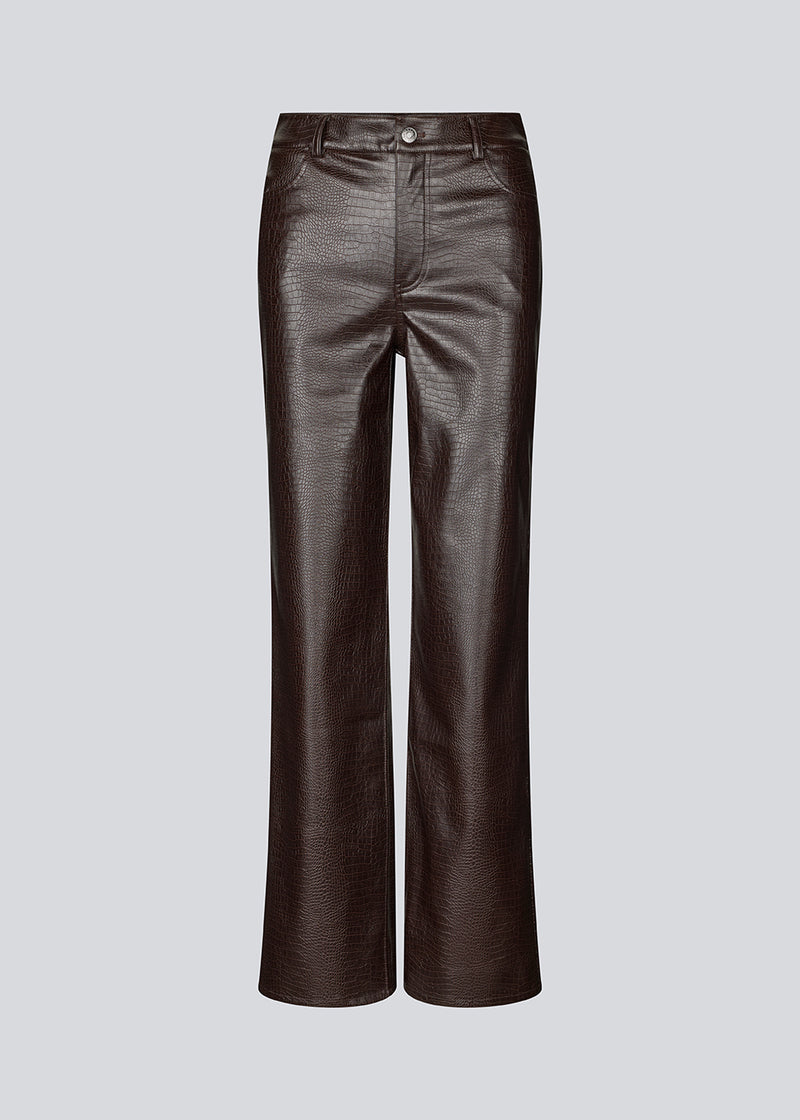 Faux leather trousers in dark brown with crocodile print. Sixstenmd pants have straight legs, pockets, belt loops and hidden zipper. A cool pair of trousers that will give your outfit plenty of edge.