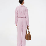 Suit pants in light pink with wide legs. The Sophiemd pants feature a zipper, belt loops, and a relaxed fit – a feminine, modern look that’s perfect with a t-shirt or knit.

