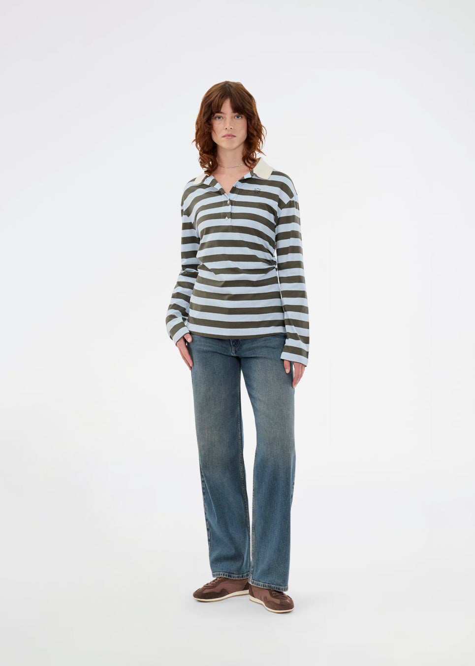 Form-fitting polo with thick blue and green stripes and a chest logo. The Stetsonmd polo has a collar, long sleeves and button closure at the chest. A stylish polo shirt that stands out and lifts both suit trousers and jeans to a sharp look.