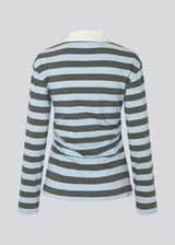 Form-fitting polo with thick blue and green stripes and a chest logo. The Stetsonmd polo has a collar, long sleeves and button closure at the chest. A stylish polo shirt that stands out and lifts both suit trousers and jeans to a sharp look.