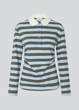 Form-fitting polo with thick blue and green stripes and a chest logo. The Stetsonmd polo has a collar, long sleeves and button closure at the chest. A stylish polo shirt that stands out and lifts both suit trousers and jeans to a sharp look.