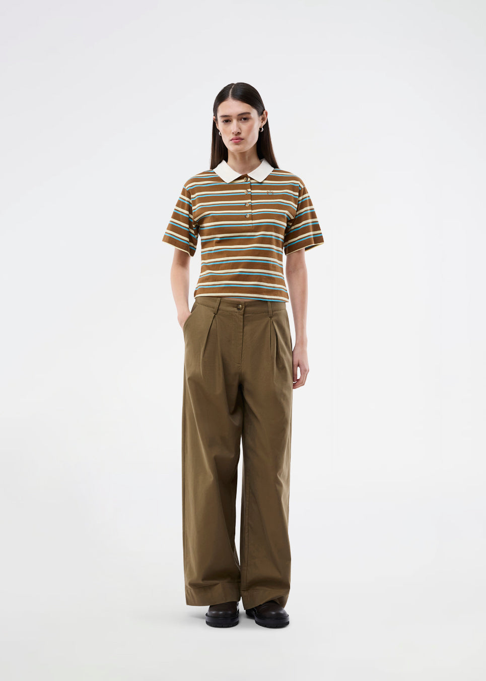 Short-sleeve polo with stripes. The StetsonMD SS Polo is fitted with wide sleeves and features a collar, buttons, and a subtle chest logo. A sporty and modern top that combines classic details with a feminine fit.
 
