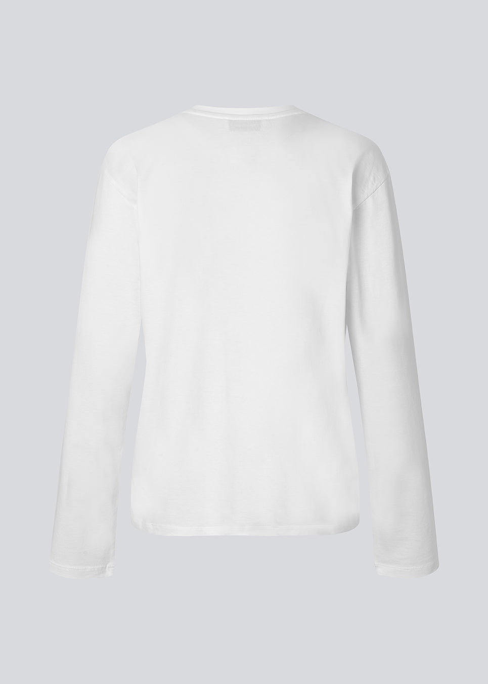 Long-sleeved white T-shirt in 100% organic cotton with "Out of Office" print on the chest. The Sugarmd LS shirt is a casual but cool choice for everyday life with the quote in a fresh pink color.