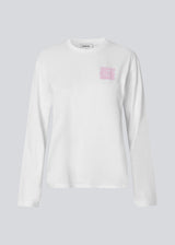 Long-sleeved white T-shirt in 100% organic cotton with "Out of Office" print on the chest. The Sugarmd LS shirt is a casual but cool choice for everyday life with the quote in a fresh pink color.