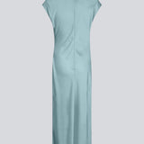Sleeveless maxi dress in blue with pleats in the side. TailorMD dress is made in satin and has a high neck, invisible zipper in the back and a slit in the side seam. The model is 175 cm and wears a size s/36.