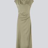 Sleeveless maxi dress light green with pleats on the side. TailorMD dress is made in satin and has a high neck, an invisible zipper in the back, and a slit in the side seam.&nbsp;
