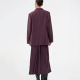 Purple sleeveless maxi dress with pleats in the side. TailorMD dress is made in satin and has a high neck, invisible zipper in the back and a slit in the side seam. The model is 175 cm and wears a size s/36.