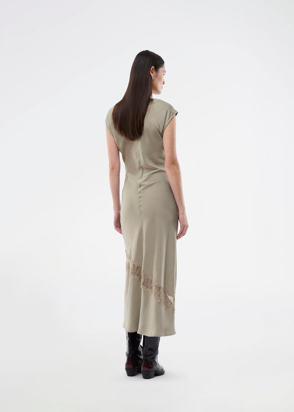 Long sleeveless satin dress with ruched detailing. The TailorMD Lace Dress features lace accents, a high neckline, an invisible back zipper, and a side slit. 