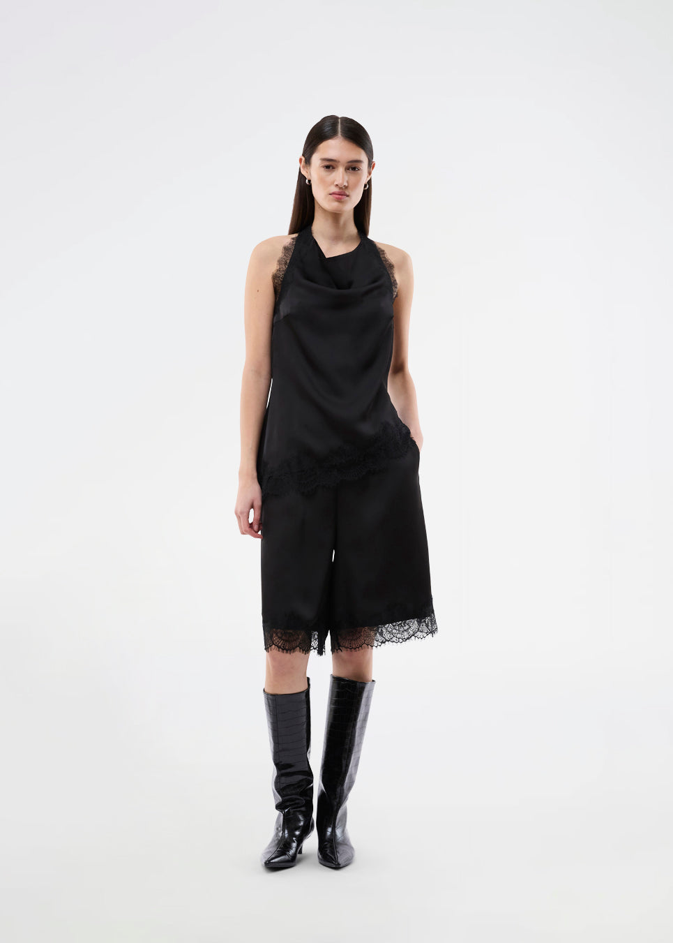 Elegant and sophisticated top. TamalMD top is designed with graceful draping and delicate lace details that create a feminine and exclusive look. Perfect for both evening wear and styling with a modern, fashion-forward touch.