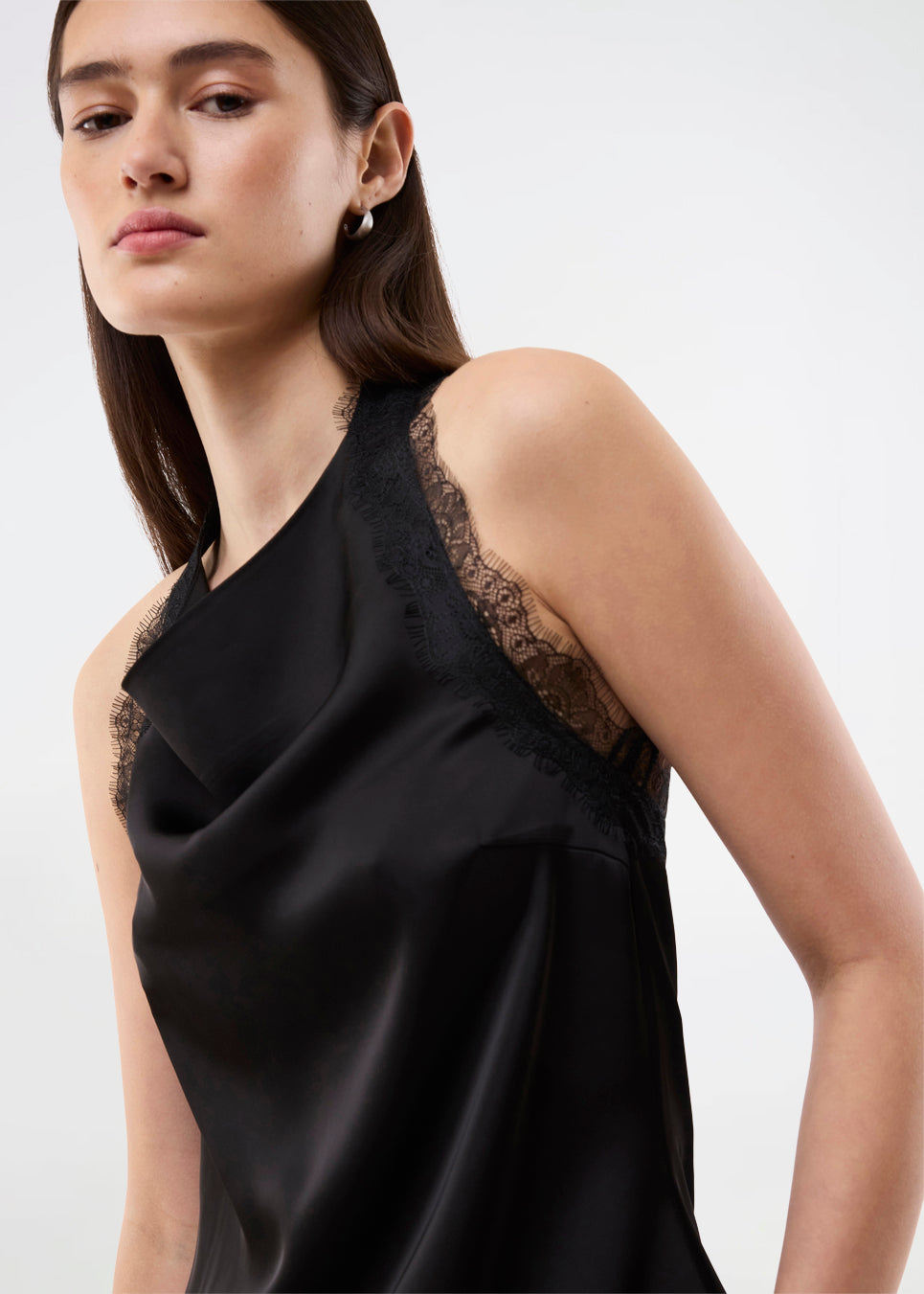 Elegant and sophisticated top. TamalMD top is designed with graceful draping and delicate lace details that create a feminine and exclusive look. Perfect for both evening wear and styling with a modern, fashion-forward touch.