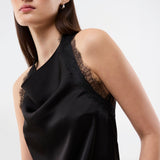 Elegant and sophisticated top. TamalMD top is designed with graceful draping and delicate lace details that create a feminine and exclusive look. Perfect for both evening wear and styling with a modern, fashion-forward touch.