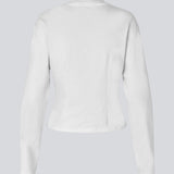 Slightly cropped long-sleeved t-shirt in white in 100% organic cotton. Tampamd LS t-shirt has a round neck and a fitted look.