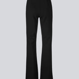 Nice pants with flared legs and front pockets. The stretchy material and elastic waist create the perfect fit. Tanny Flare pants in Black are a must-have basic style in your wardrobe. The model is 174 cm and wears a size S/36