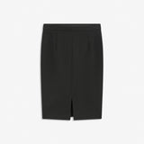 Simple, stylish and a must-have tight skirt. Tanny skirt is knee length and has a small slit at the back. The stretchable material creates a perfect fit. The model is 174 cm and wears a size S/36