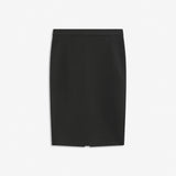 Simple, stylish and a must-have tight skirt. Tanny skirt is knee length and has a small slit at the back. The stretchable material creates a perfect fit. The model is 174 cm and wears a size S/36
