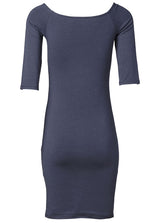 Tansy dress in navy noir is an off shoulder dress with narrow sleeves. The dress has a clean look and a slim fit. Tansy dress is a knee length dress. 