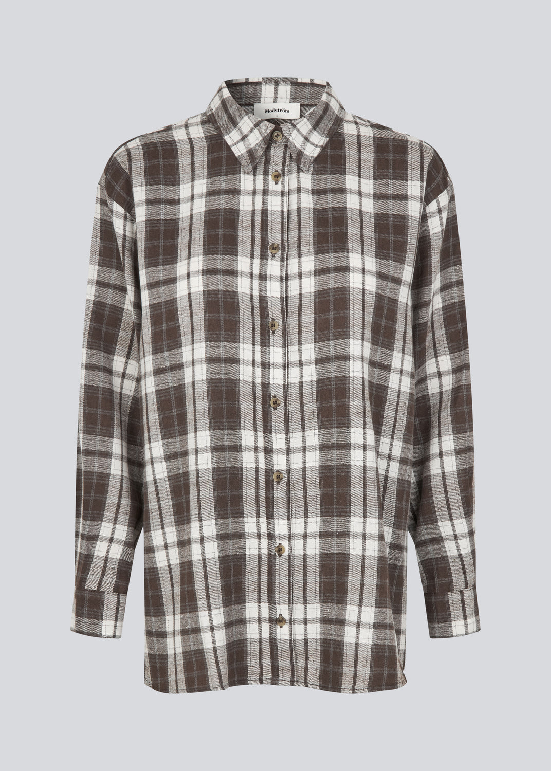 Classic oversize shirt in flannel in brown. TappoMD shirt has a chest pocket, button closure in front and a manchet with button closure.&nbsp;