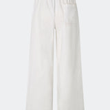 Lightweight trousers crafted from a soft cotton quality. Tessamd pants feature wide legs, an elasticated waistband with adjustable side ties, and a clean, relaxed look. A comfortable and versatile style that combines minimalist design with a modern fit.