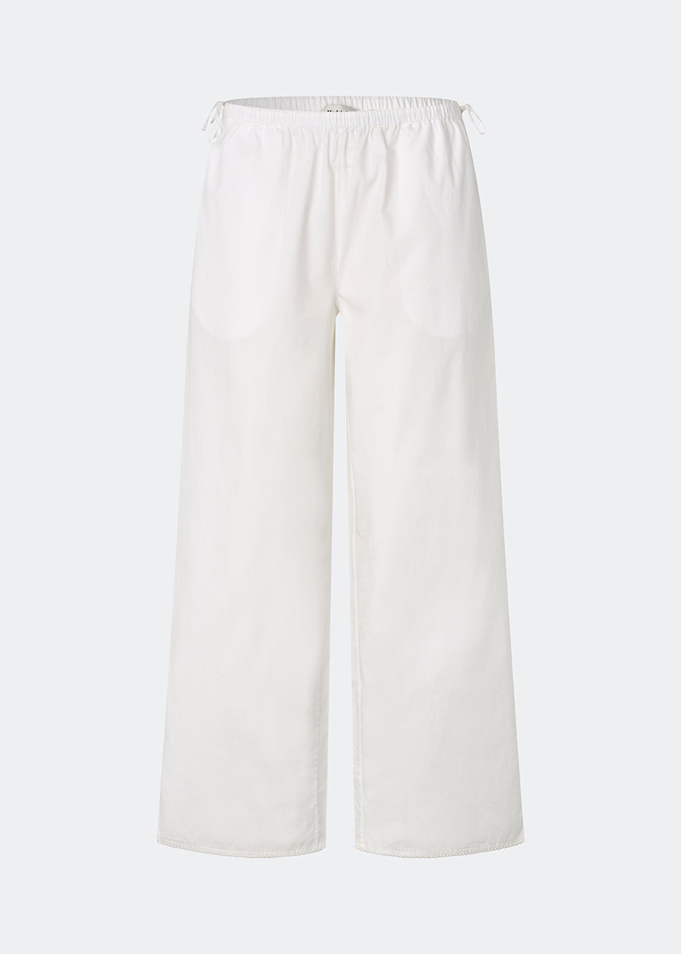 Lightweight trousers crafted from a soft cotton quality. Tessamd pants feature wide legs, an elasticated waistband with adjustable side ties, and a clean, relaxed look. A comfortable and versatile style that combines minimalist design with a modern fit.
