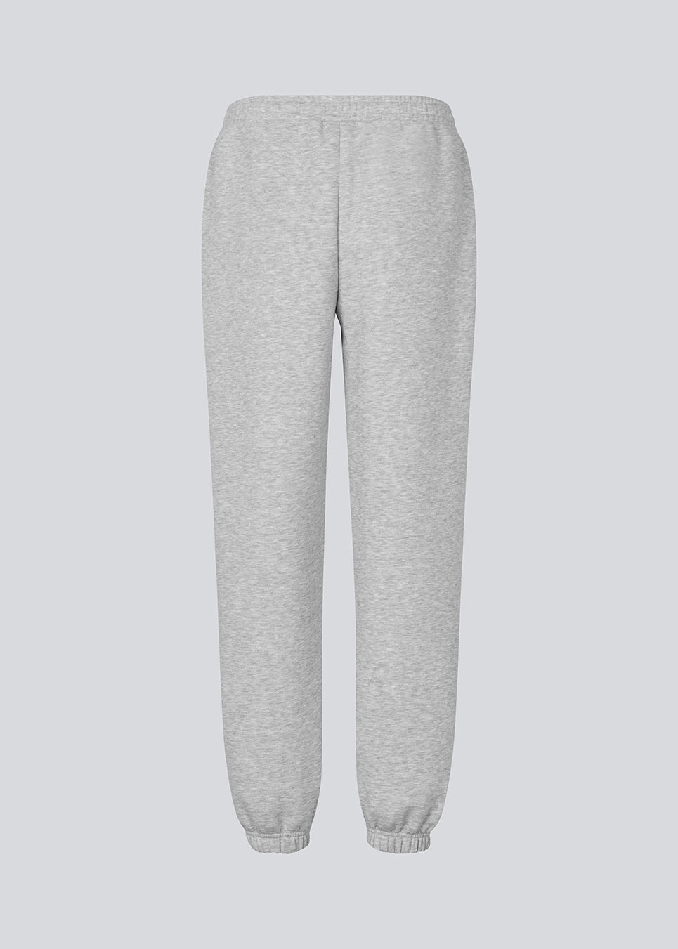 Sweatpants in grey with logo in a cotton mixture. TiaMD pants have sidepockets, tieband and an elastic in the bottom and waist.