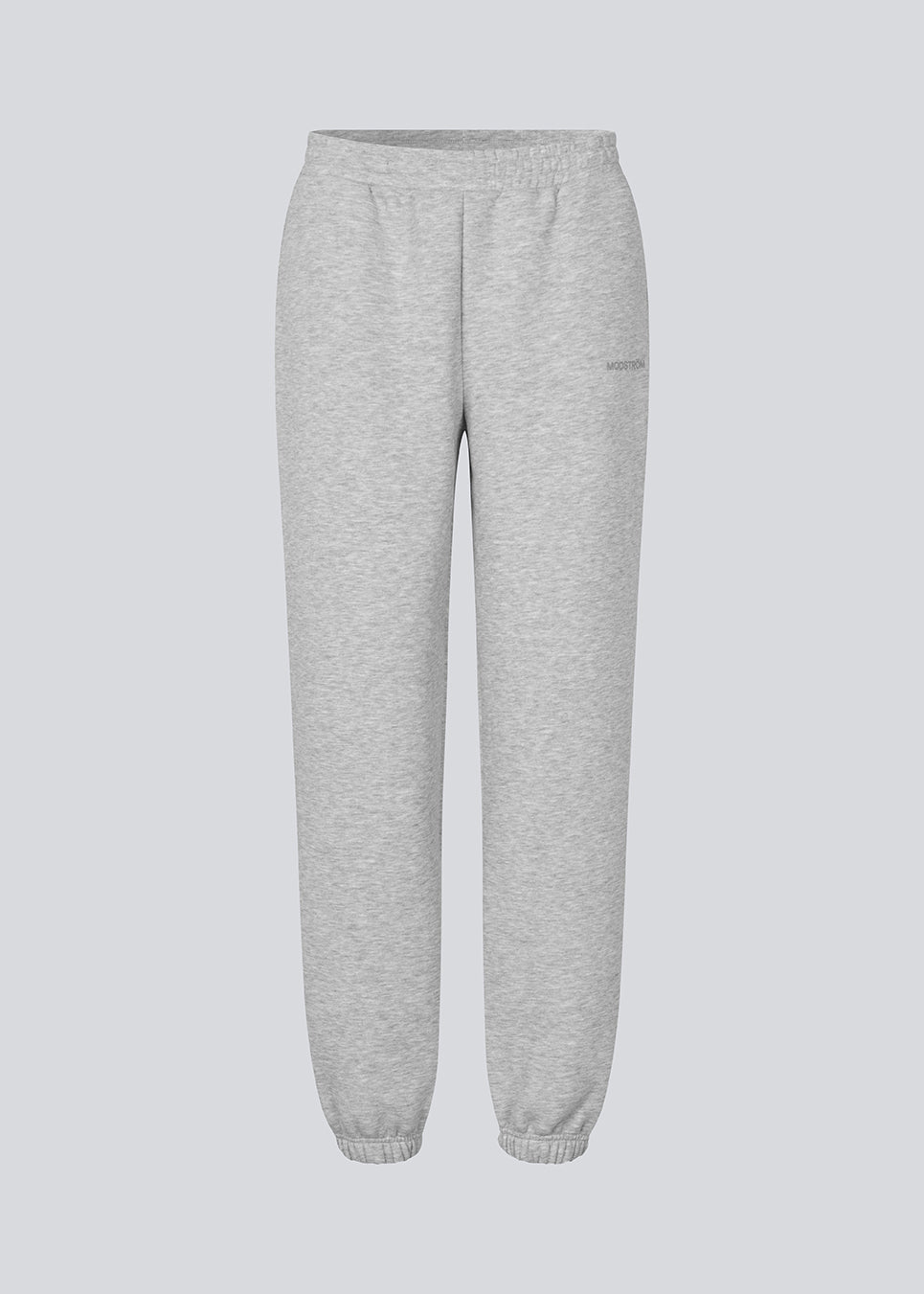 Sweatpants in grey with logo in a cotton mixture. TiaMD pants have sidepockets, tieband and an elastic in the bottom and waist.