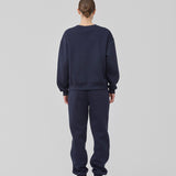 Sweatpants in navy blue with logo in a cotton mixture. TiaMD pants have side pockets, a tieband and an elastic in the bottom and waist.