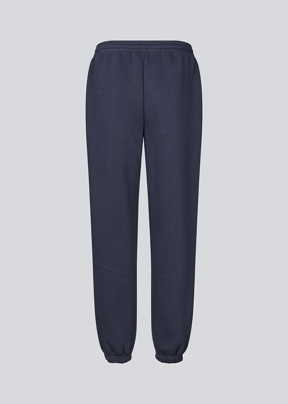 Sweatpants in navy blue with logo in a cotton mixture. TiaMD pants have side pockets, a tieband and an elastic in the bottom and waist.