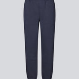 Sweatpants in navy blue with logo in a cotton mixture. TiaMD pants have side pockets, a tieband and an elastic in the bottom and waist.