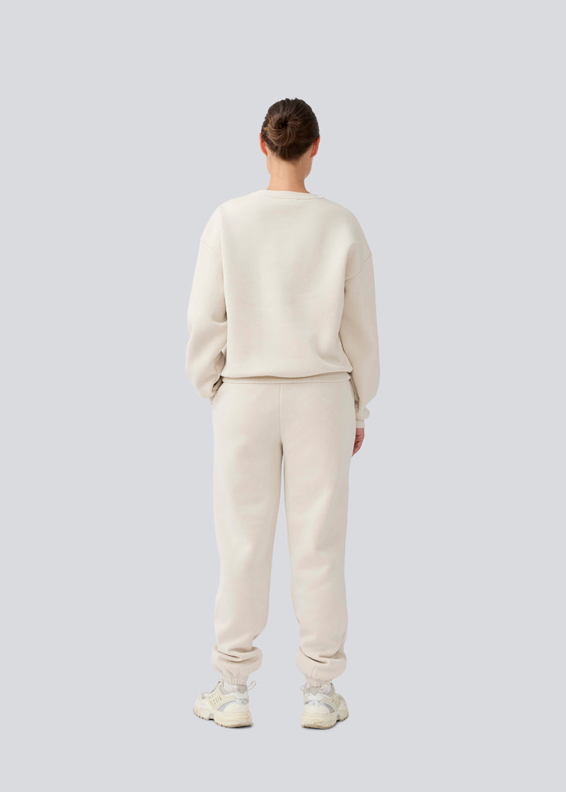 Sweatpants with logo in a cotton mixture. TiaMD pants has sidepockets, tieband and an elastic in the bottom and waist. 