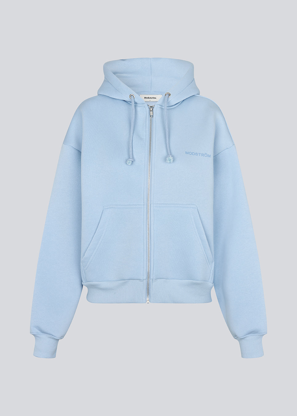 Hoodie in light blue/baby blue with a zipper and logo in a cotton mixture. TiaMD Zip has pockets, ribbing at the sleeves and bottom and a hood with strings.