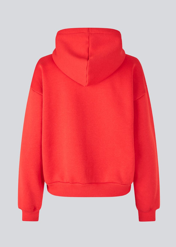 Sweatshirt in bright red with a zipper and logo in a cotton mixture. TiaMD Zip has pockets, ribbing at the sleeves and bottom and a hood with strings.&nbsp;