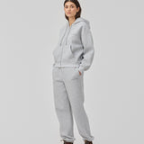 Sweatshirt in grey with a zipper and logo in a cotton mixture. TiaMD Zip has pockets, ribbing at the sleeves and bottom and a hood with strings.