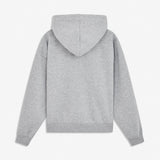 Sweatshirt in grey with a zipper and logo in a cotton mixture. TiaMD Zip is a hoodie with pockets, ribbing at the sleeves and bottom and a hood with strings. The model is 175 cm and wears a size S/36.