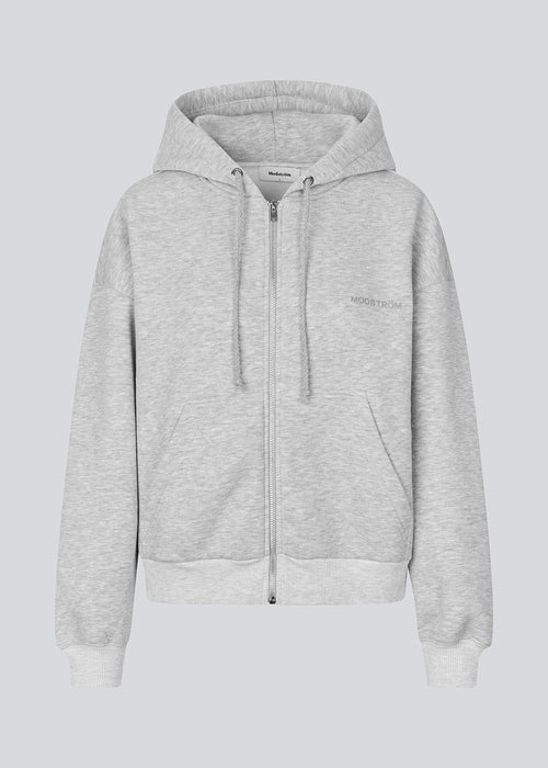 Sweatshirt in grey with a zipper and logo in a cotton mixture. TiaMD Zip has pockets, ribbing at the sleeves and bottom and a hood with strings.