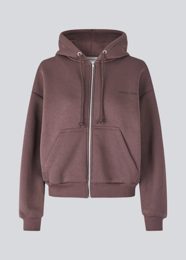 Sweatshirt in brown with a zipper and logo in a cotton mixture. TiaMD Zip has pockets, ribbing at the sleeves and bottom and a hood with strings.&nbsp;