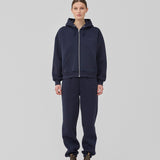 <p>Sweatshirt in navy blue with a zipper and logo in a cotton mixture. TiaMD Zip has pockets, ribbing at the sleeves and bottom, and a hood with strings.</p> <p><a href="https://modstrom.com/products/tiamd-pants-navy-sky" title="tiamd-pants-navy-sky">Style with matching pants.</a></p>