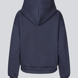 <p>Sweatshirt in navy blue with a zipper and logo in a cotton mixture. TiaMD Zip has pockets, ribbing at the sleeves and bottom, and a hood with strings.</p> <p><a href="https://modstrom.com/products/tiamd-pants-navy-sky" title="tiamd-pants-navy-sky">Style with matching pants.</a></p>