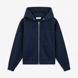 Sweatshirt in navy blue with a zipper and logo in a cotton mixture. TiaMD Zip has pockets, ribbing at the sleeves and bottom, and a hood with strings. The model is 175 cm and wears a size S/36.