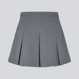 Short skirt in grey with box pleats in a structured material. TianaMD skirt has a hidden zipper on the side.