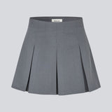 Short skirt in grey with box pleats in a structured material. TianaMD skirt has a hidden zipper on the side.
