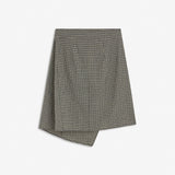 Tikkamd Skirt is a midi skirt with an asymmetric silhouette and classic checked pattern. The design features a wrap-effect front, tie detail at the waist and a small slit. Style it with the Tikkamd Top or Tikkamd Shirt for a complete checked look.