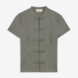 TikkaMD Top is a short-sleeved top with a relaxed fit and classic checked pattern. The design features a round neckline and decorative button fastenings at the front. Style it with jeans or matching Tikkamd Skirt.&nbsp;