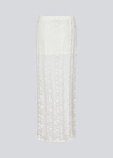 Maxi skirt in a white see-through lace material. TildeMD skirt has a lining and an elastic waistband.