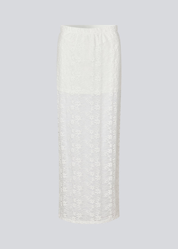 Maxi skirt in a white see-through lace material. TildeMD skirt has a lining and an elastic waistband.