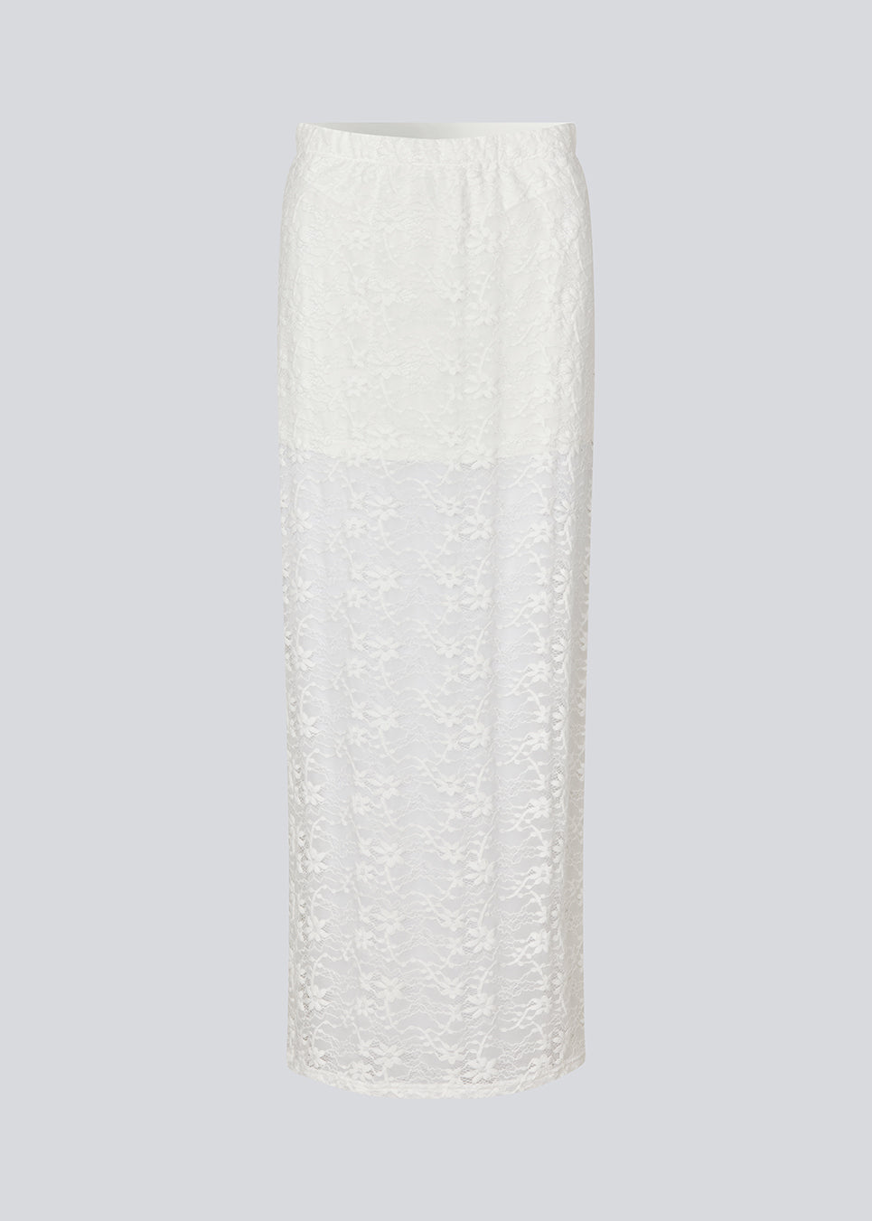 Maxi skirt in a white see-through lace material. TildeMD skirt has a lining and an elastic waistband.