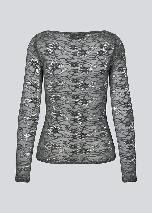 Fitted top in dark green in a see-through lace material. TildeMD top has long sleeves and a wider neckline.&nbsp;