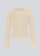 Fine knit jumper in summer sand in a drapy quality. TomMD o-neck has a slightly cropped length with long, flared sleeves. Ribknit on neckline and hem. 
